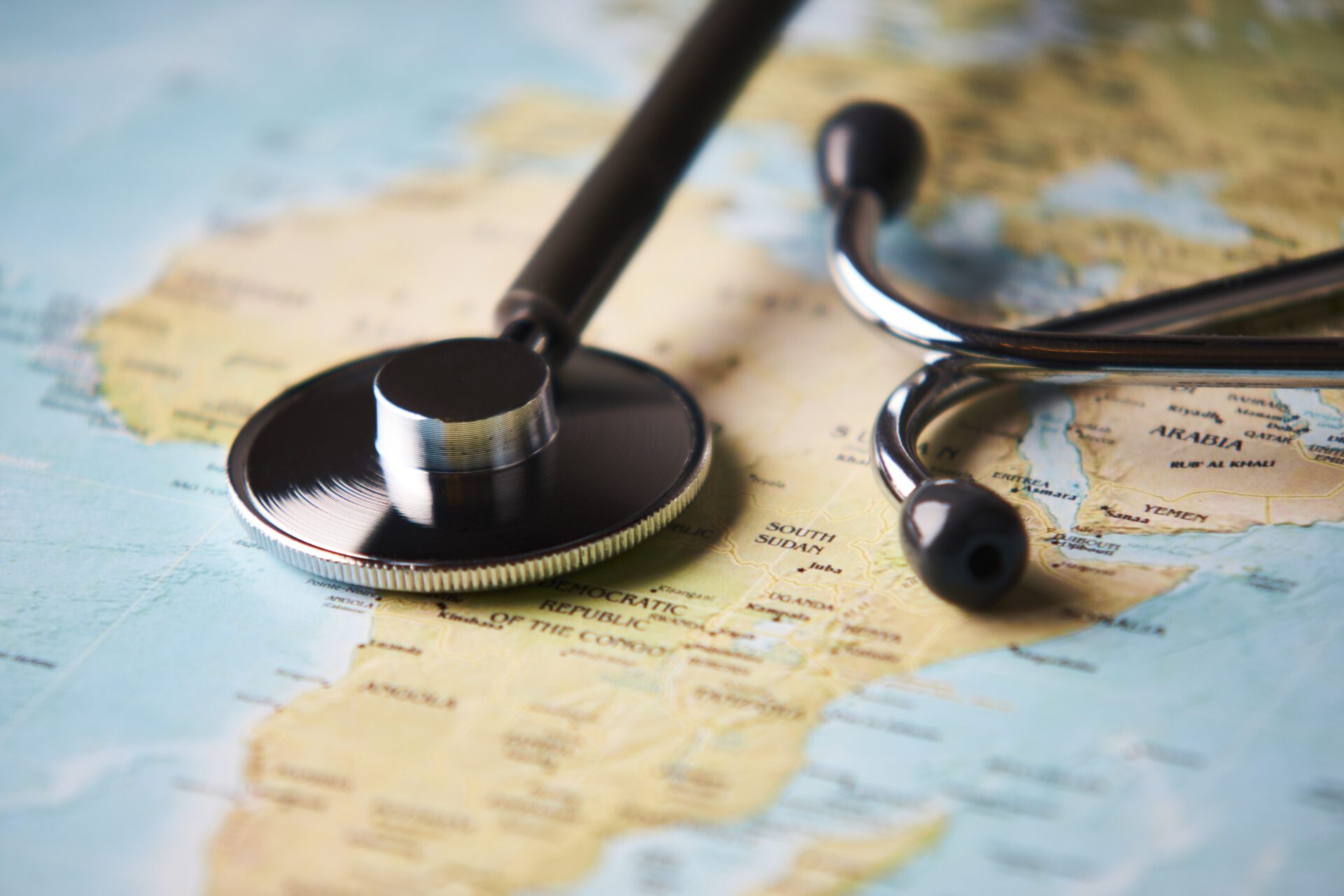 Doctor's medical stethoscope over africa healthcheck. Medical concept tourism travel care diseases healthy, close-up.